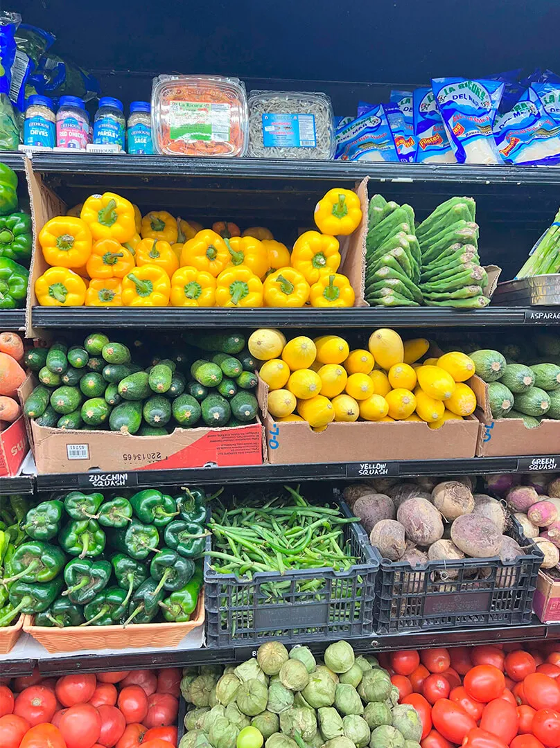 Shelf with variety of vegetables at La Placita Meat Market