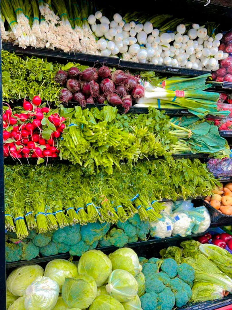 Shelf with variety of vegetables at La Placita Meat Market