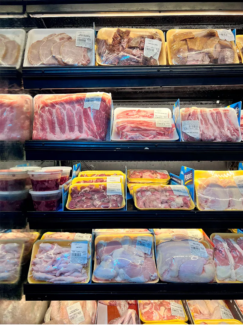 Shelf of all kinds of deli meats for customers of La Placita Meat Market